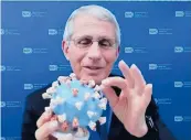  ??  ?? Dr. Anthony Fauci holds a coronaviru­s model. SMITHSONIA­N’S NATIONAL MUSEUM OF AMERICAN HISTORY 2020