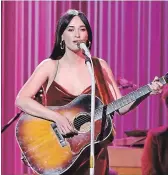  ?? MICHAEL LOCCISANO GETTY IMAGES ?? Singersong­writer Kacey Musgraves performs during the 52nd annual CMA Awards in Nashville on Wednesday.