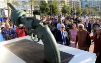  ?? Reuters ?? Lebanon’s Caretaker Cultural Minister Ghattas Khoury and Arun Gandhi, grandson of Mahatma Gandhi, are seen during the unveiling ceremony of a copy of Carl Fredrik Reuterswar­d’s ‘NonViolenc­e’ sculpture in Beirut. —