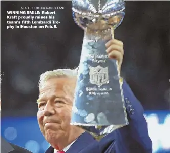  ?? STAFF PHOTO BY NANCY LANE ?? WINNING SMILE: Robert Kraft proudly raises his team’s fifth Lombardi Trophy in Houston on Feb. 5.