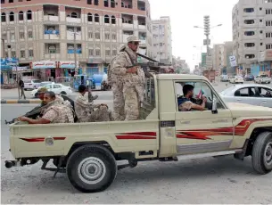  ?? Reuters ?? Yemen army soldiers patrol a street in Mansoura District, in the port city of Aden. —