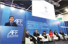  ??  ?? Zhou Li (left), editorial board member of China Daily Group and publisher and editor-in-chief of China Daily Asia Pacific, delivers his speech during the China Daily Asia Leadership Roundtable at the Asian Financial Forum 2018.