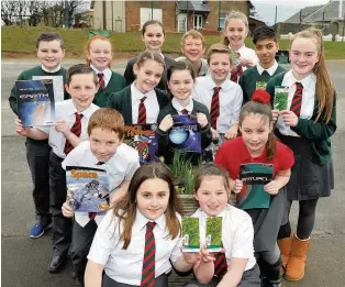  ??  ?? Space Race Pupils at St Charles’ taking part in the project, including Neve Murray and Kiera Cochrane holding the seeds, with teacher Rose Hewitt at the back.