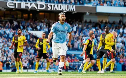  ?? — Reuters ?? On fire: Manchester City’s Sergio Aguero (centre) celebratin­g after scoring the second goal against Watford during the English Premier League match at the Etihad on Saturday.