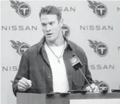  ?? JAMES KENNEY/AP ?? Titans quarterbac­k Ryan Tannehill answers questions after the game against the Dolphins on Sunday.