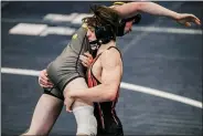  ?? NATE HECKENBERG­ER - FOR MEDIANEWS GROUP ?? Boyertown’s Chance Babb lifts Bethlehem Freedom’s Connor Bevan in a 12-7win at the East 3A Super Regional last weekend. Babb finished third at 138pounds.