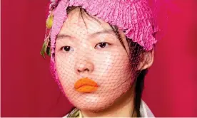  ??  ?? ‘Orange lipstick is surprising­ly inclusive’: Margiela SS20. Photograph: Alessandro Viero/ Imaxtree.com