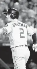  ?? PATRICK SEMANSKY/AP ?? Alex Bregman, the second overall pick in the 2015 draft, admires his grand slam in Saturday’s Game 4 of the World Series.