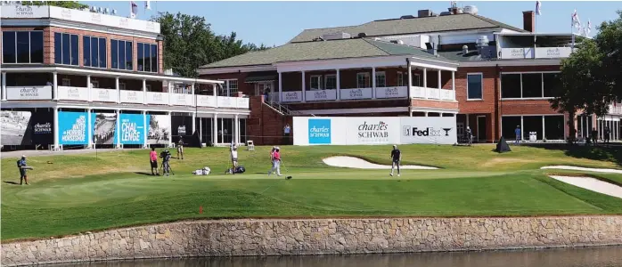  ?? RON JENKINS/GETTY IMAGES ?? The 18th hole at Colonial offers an odd scene Sunday, with no fans and limited officials in attendance. The Charles Schwab Challenge was the return event on the PGA Tour from the COVID-19 pandemic.