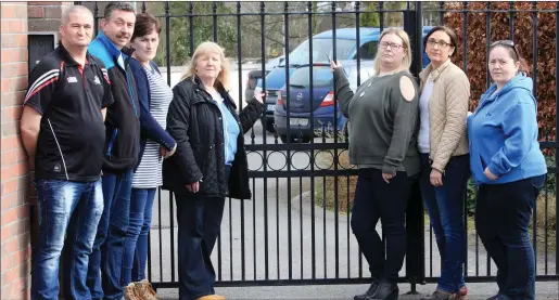  ??  ?? ( L- R), John Doyle, Clr. Thomas Healy, Carmel Branley, Jackie Wynne, Yvonne Rainer, Maria Gilroy and Janice Doyle outside the gates of the Solas Respite Centre in Ballytivna­n yesterday. ( Monday) Parents are protesting at the cutbacks in this vital...