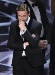  ?? THE ASSOCIATED PRESS ?? Ryan Gosling reacts as the true winner of best picture is announced at the Oscars on Sunday, Feb. 26, at the Dolby Theatre in Los Angeles. It was originally announced that “La La Land” won, but the winner was actually, “Moonlight.”