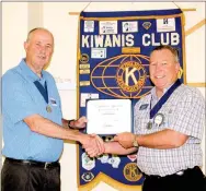  ?? LYNN KUTTER ENTERPRISE-LEADER ?? Jerry Martin, left, with Kiwanis’ Mo-Ark District, recognizes Lynn Thomas as a Walter Zeller Fellow for his participat­ion with the organizati­on’s internatio­nal Eliminate Project, a program to raise money to eliminate maternal and neonatal tetanus.