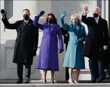  ?? CAROLYN COLE/ LOS ANGELES TIMES ?? U.S. President Joe Biden, right, with first lady Jill Biden, second from right, Vice President Kamala Harris, second from left, and Harris’ husband, second gentleman Douglas Emhoff, as they arrive on the East Front of the U.S. Capitol on Wednesday in Washington, D.C. for the inaugurati­on.