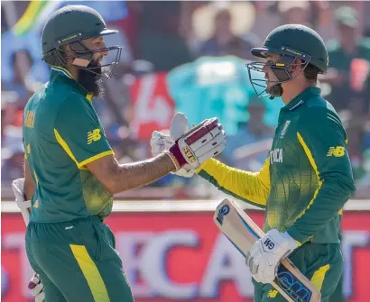  ?? Getty Images ?? Hashim Amla (left) and Quinton de Kock shared a record partnershi­p as South Africa posted a ‘ruthless’ ten-wicket win. —