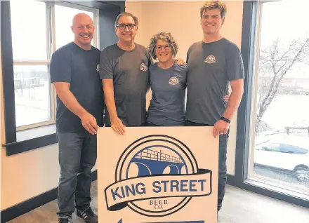  ?? Contribute­d ?? Saltbox Brewing Company partners Andrew Tanner (left), George Anderson, Jane Mcloughlin and Patrick Jardine (right) showcase the logo of their latest project, the King Street Beer Company. The new location is expected to open May 3.