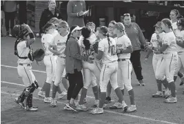  ?? KAITLIN MCKEOWN kmckeown@newsobserv­er.com ?? N.C. State celebrates after a defensive stop by Amanda Hasler at home plate during the second inning of the Wolfpack’s 4-3 loss to Duke on Friday, April 26, 2024, at Dail Softball Stadium in Raleigh, N.C.