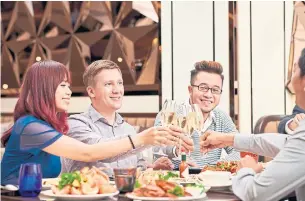  ?? DREAMSTIME PHOTOS ?? Meals with friends and co-workers are extra seasonal expenses that often get forgotten.