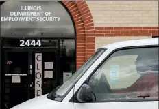  ?? NAM Y. HUH — THE ASSOCIATED PRESS ?? A man looks at the closed sign in front of Illinois Department of Employment Security in Chicago, Wednesday, April 15, 2020. With half-a-million people bounced out of jobs in the past month because of the COVID-19pandemic, Illinois’ unemployme­nt safety net has been stretched to the limit.