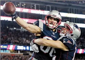  ?? AP/DAVID J. PHILLIP ?? New England Patriots wide receiver Danny Amendola celebrates with teammate Chris Hogan after catching a touchdown pass in the second half Sunday against the Jacksonvil­le Jaguars.