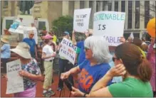  ??  ?? Two hundred protesters rallied in the shadow of Old Glory at the Historic Courthouse in West Chester Saturday during the March for the Environmen­t.