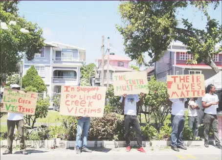  ??  ?? Relatives and friends of those killed at Lindo Creek in 2008 rallying in support of justice for them yesterday.