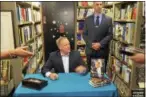  ?? JOSEPH PHELAN — JPHELAN@ DIGITALFIR­STMEDIA. COM ?? Sean Spicer signs copies of his memoir Wednesday morning.
