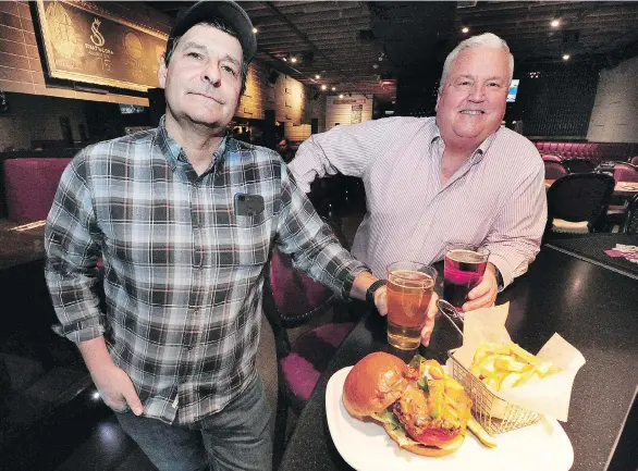  ?? NICK PROCAYLO ?? Romer’s Burger Bar chef Jim Romer, left, and partner Kelly Gordon have modified their employees’ work schedules to attract millennial­s to the profession.