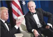  ??  ?? A photo taken on May 4 shows Turnbull listening as Trump talks to the press at the Intrepid Sea, Air and Space Museum in New York.