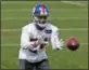  ?? THE ASSOCIATED PRESS ?? FILE - In this April 24, 2018, file photo, New York Giants’ Eli Apple catches a ball during NFL football training camp in East Rutherford, N.J.