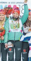  ??  ?? Celine Mayer auf dem Podium als Staffelwel­tmeisterin 2018.