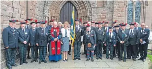  ??  ?? Angus Branch members at the service with, centre from left, the Rev Roderick Grahame, Lord Lieutenant of Angus Georgiana Osborne, standard bearer Brian Smith and Provost of Angus Major Ronnie Proctor.