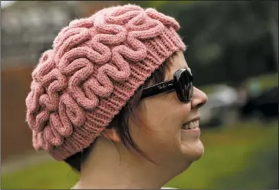  ?? The Associated Press ?? THINKING CAP: Anne Herdman Royal wears a brain hat during the March for Science on Saturday in Chattanoog­a, Tenn. About a thousand demonstrat­ors marched from the Main Terrain Art Park to Riverfront Parkway and back in support of science and education...