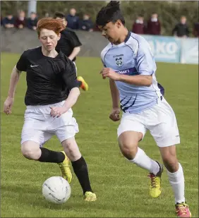  ??  ?? Rian Conaty of Grange Post Primary and Josh Cronin of Boyle in action. Pics: D Hackett.