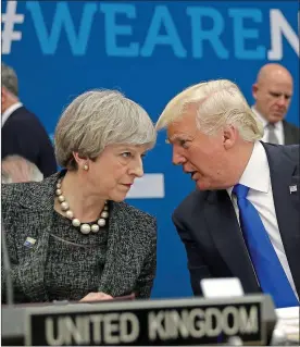  ??  ?? Heads together? Theresa May and Donald Trump at a Nato summit in 2017