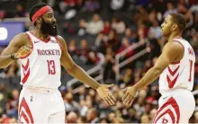  ?? Rob Carr / Getty Images ?? James Harden, left, who averaged 44 minutes per game on the road trip, says the Rockets need to limit mistakes defensivel­y.