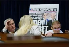  ?? CAROLYN KASTER — THE ASSOCIATED PRESS ?? Rep. Marjorie Taylor Greene, R-GA., center, talks with House Oversight and Accountabi­lity Committee Chairman James Comer, R-KY., and House Judiciary Committee Chair Jim Jordan, R-ohio, during a hearing titled “Protecting Speech from Government Interferen­ce and Social Media Bias, Part 1: Twitter’s Role in Suppressin­g the Biden Laptop Story” on Capitol Hill on Wednesday.