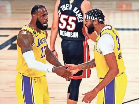  ?? KIM KLEMENT/USA TODAY SPORTS ?? Anthony Davis (3) says of his dynamic with LeBron James: “When we watch film or even during the course of a game, if I did something wrong, he tells me. If he does something wrong, I tell him. That’s what makes it work.”