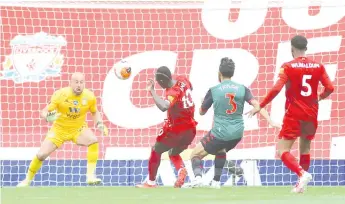  ??  ?? Mane (centre) scores the opening goal during the English Premier League football match between Liverpool and Aston Villa at Anfield in Liverpool, north west England.
- AFP photo