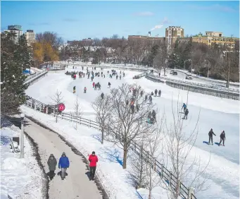  ?? ASHLEY FRASER ?? The sun helps to get people out despite Saturday's chill as skaters enjoy the canal and city rinks while hikers flock to trails. Temperatur­es are expected to be above average this week.