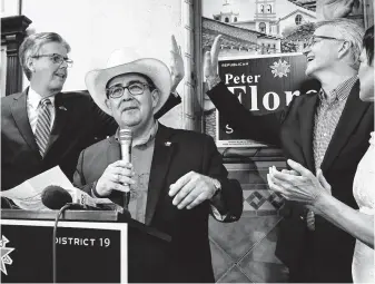  ?? Tom Reel / Staff photograph­er ?? Pete Flores declared victory in his Senate District 19 contest as Lt. Gov. Dan Patrick, left, and Republican Party Chairman James Dickey celebrate in San Antonio.