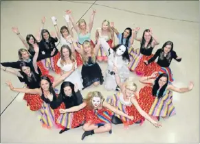  ??  ?? Clowning around: Dancers dressed as clowns will represent Rapunzel’s fears of the outside world in Aotea College’s Stage Challenge performanc­e on May 24. At centre are the show’s creators – Chloe Munro, who created the costumes, Hayley Brown, who plays...