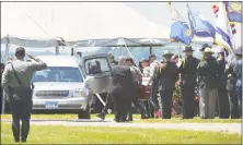  ?? Alex von Kleydorff / Hearst Connecticu­t Media ?? The casket containing State Trooper 1st Class Walter Greene Jr. is moved into a hearse during a funeral service at Sherwood Island State Park on Tuesday in Westport.