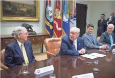  ?? NICHOLAS KAMM, AFP/GETTY IMAGES ?? President Trump meets with Senate Majority Leader Mitch McConnell, left, House Speaker Paul Ryan and Senate Majority Whip John Cornyn at the White House on June 6.