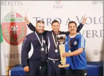  ??  ?? Mansour Al-Rashidi, with his team, celebrates after finishing third in the
skeet shooting competitio­n.