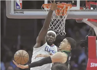 ?? AP PHoTo ?? HERE’S THE SCOOP: Jayson Tatum gets ready to put up a shot over the Clippers’ Montrezl Harrell during the Celtics’ 113-102 victory Wednesday night in Los Angeles.