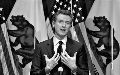  ?? AP Photo/Rich Pedroncell­i, Pool, File ?? In this Jan. 8 file photo, California Gov. Gavin Newsom outlines his 2021-2022 state budget proposal during a news conference in Sacramento, Calif.