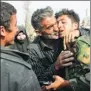  ?? XINHUA ?? A government soldier is embraced by a civilian in Syria’s eastern Ghouta on Sunday.