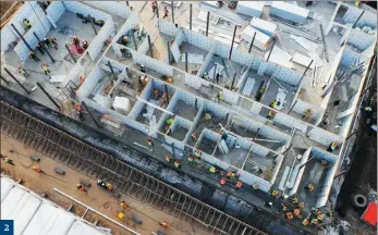  ?? CAI YANG / XINHUA ?? 2 (. Huoshensha­n Hospital in Wuhan under constructi­on on Jan 30. The temporary facility was completed within 10 days.