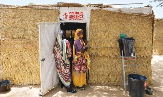  ?? AFP/Reuters ?? Sudanese refugees at a health center in the Koufroun refugee camp. Sudan’s war erupted in 2023, over a planned political transition under which the army and the RSF were competing to protect their interests.
