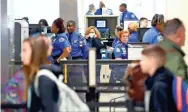  ?? JOE RONDONE/THE COMMERCIAL APPEAL ?? Travelers make their way through Memphis Internatio­nal Airport on Monday, March 16, 2020. Airport officials say that travel is down around 50 percent nationwide from this time last year, likely due to concerns over the spread of coronaviru­s.